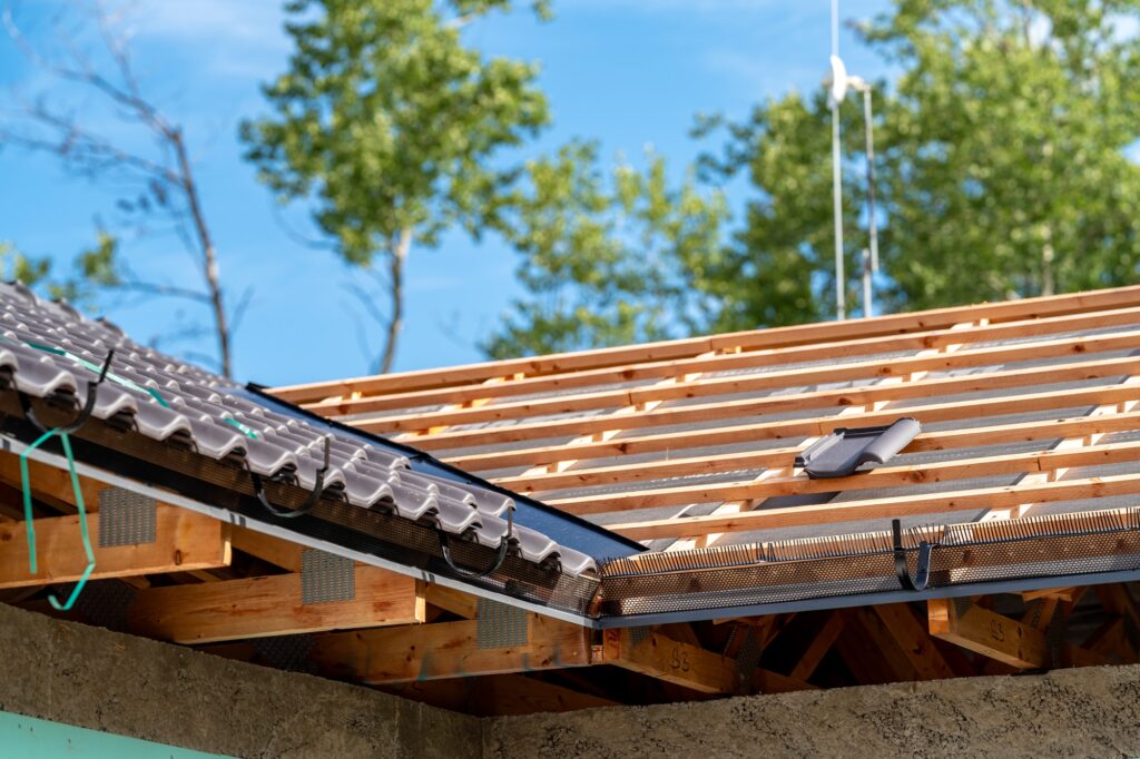 construction of the roof of a new family house on wooden beams made of ceramic tiles